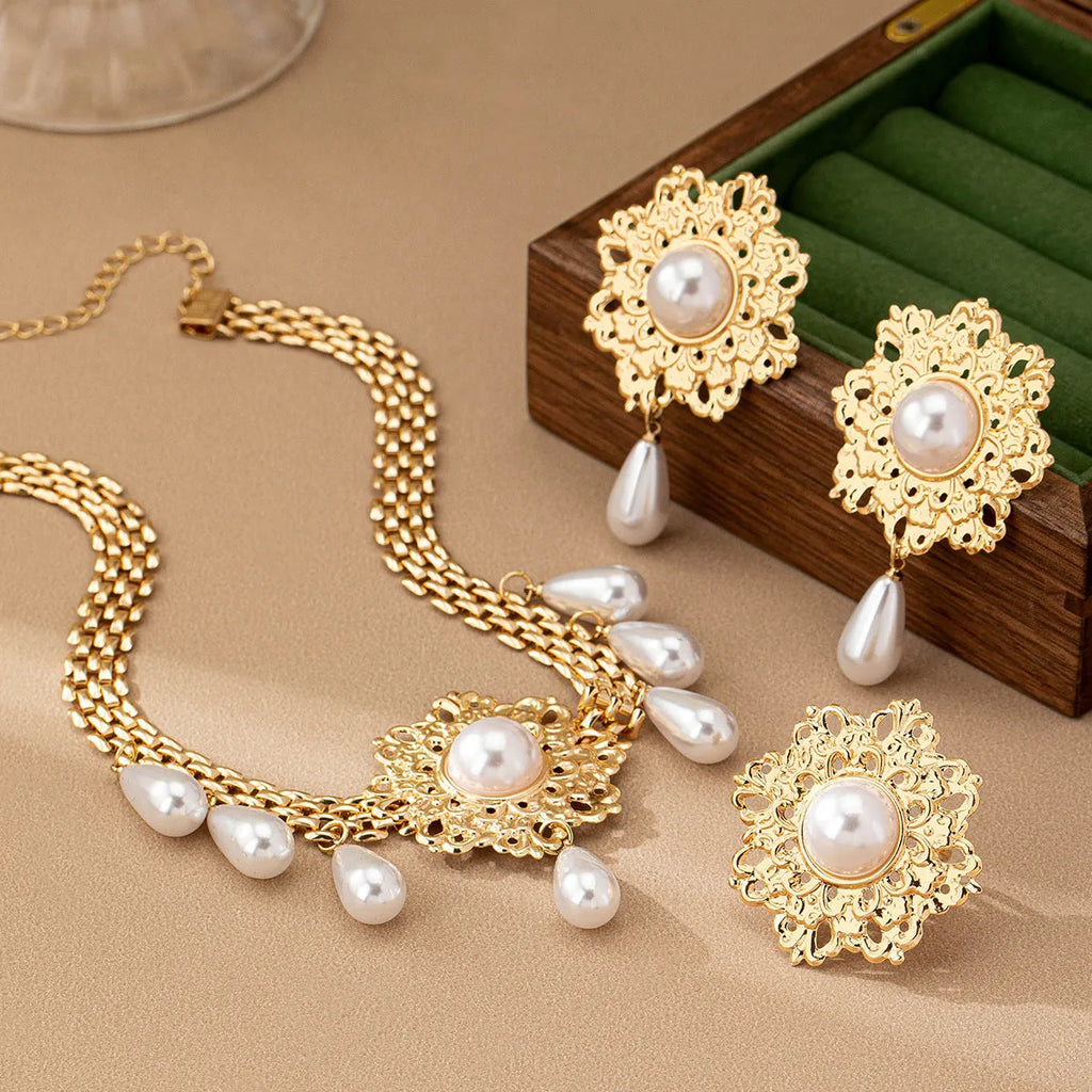 French retro hollow flower pearl tassel jewellery set in white, including necklace, earrings, and ring, alloy material