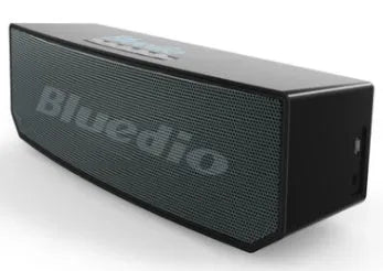 Black BS-6 Google Assistant Bluetooth smart speaker on a surface, showing its compact rectangular design.