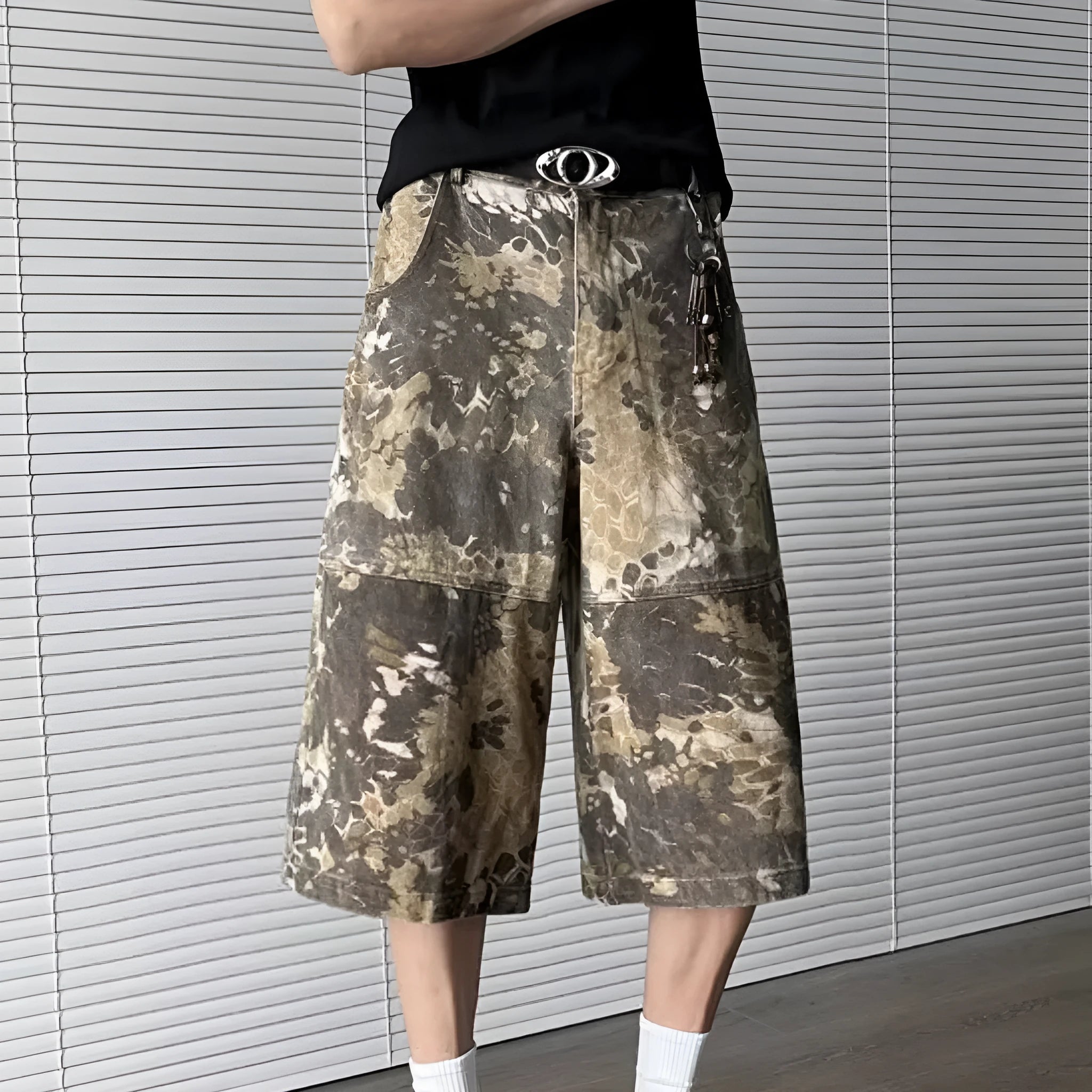 Yellow cotton jeans with a detailed snake pattern and camouflage print, featuring a cropped leg length.