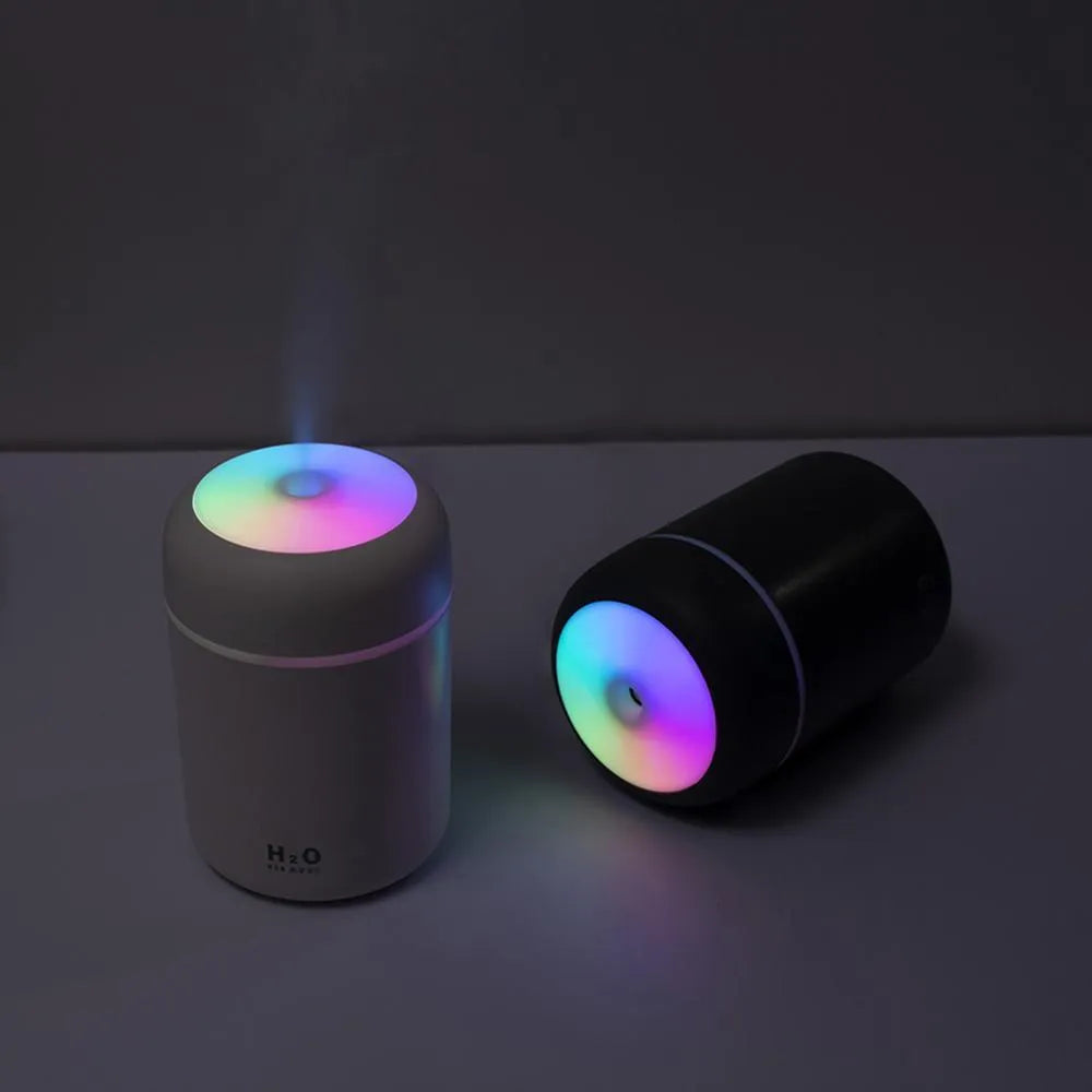 Pink USB desktop humidifier with colourful lights and water mist output