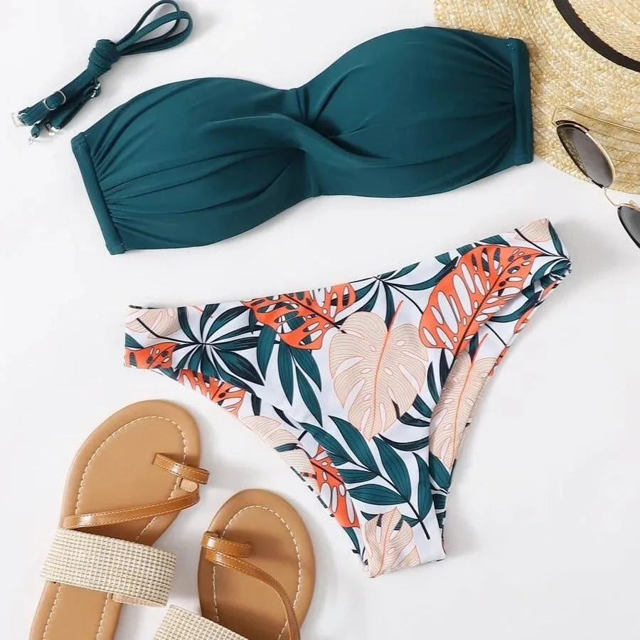 Green hard cup push up bikini swimsuit set with briefs bottom on a mannequin.