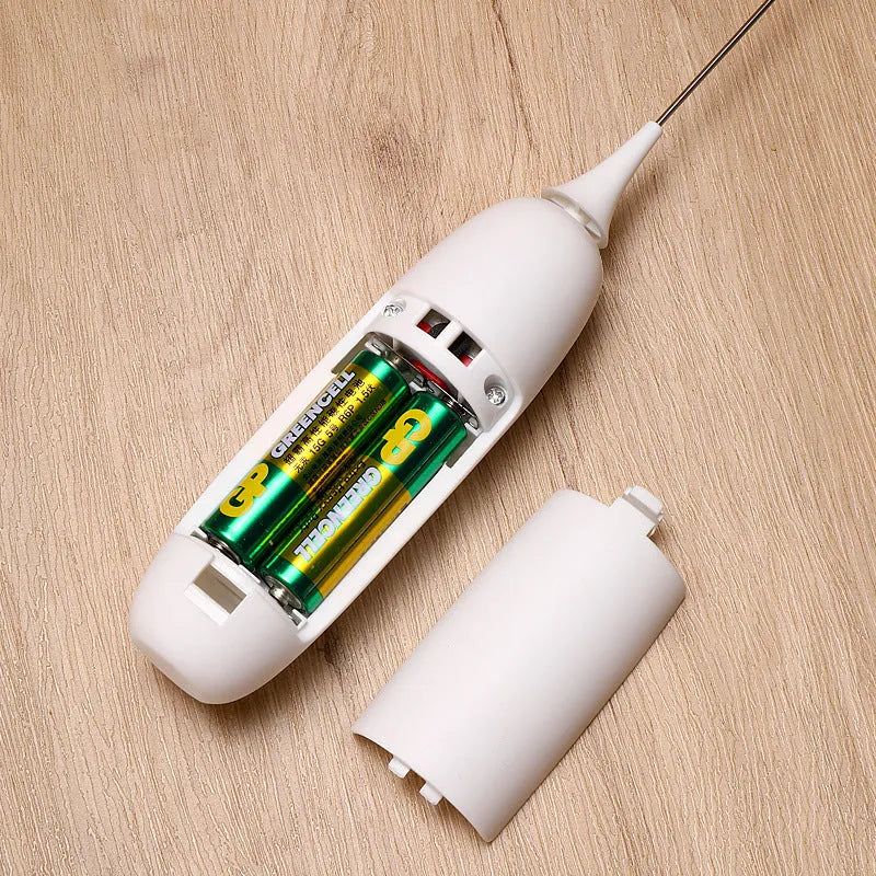 Handheld electric milk frother blender in black and white colour options on a kitchen counter.
