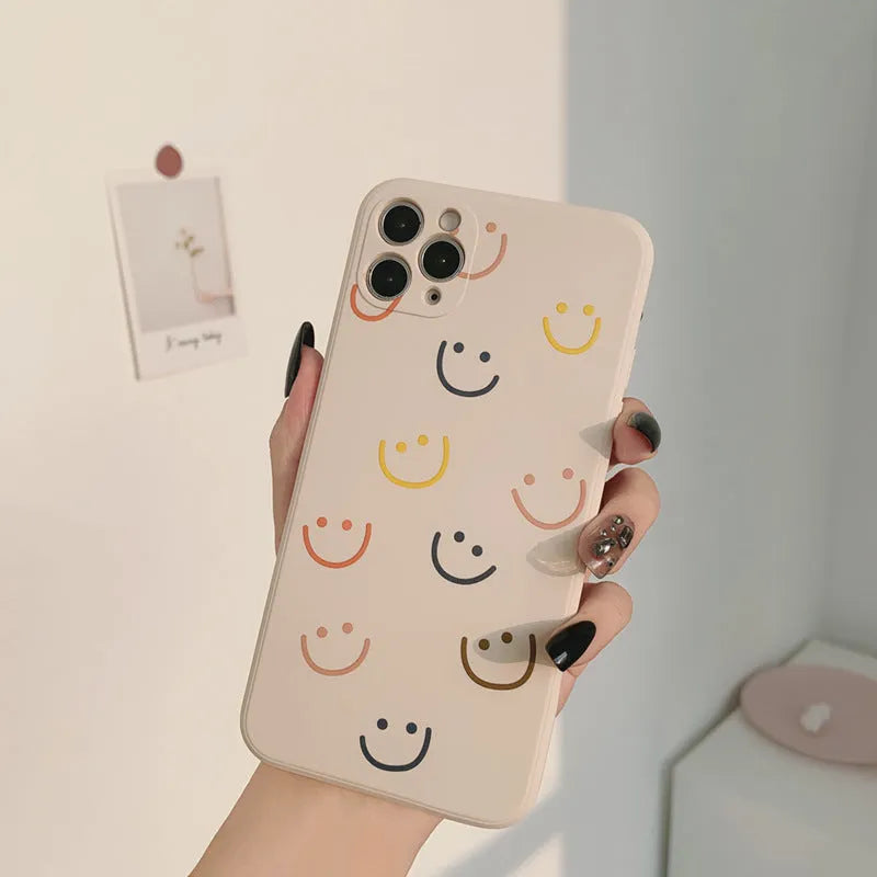 Simple Case Silicone iPhone case in graffiti design, showing Full Screen Smiley, Rainbow, and Watercolor colour options.