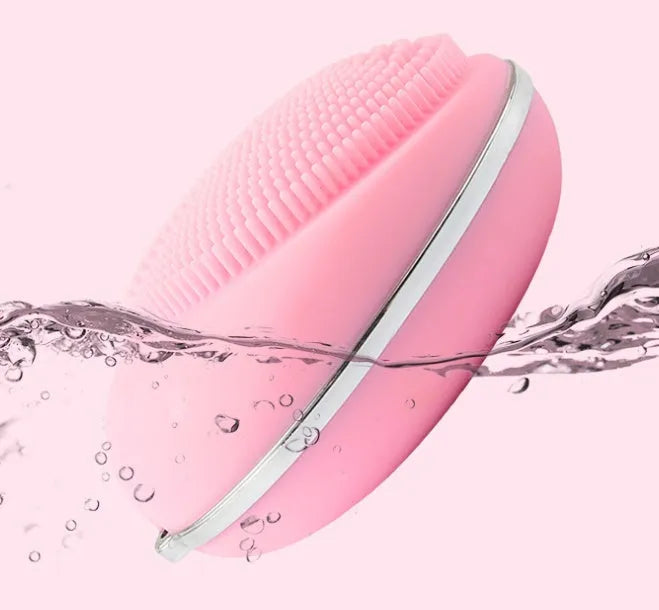 Ultrasonic electric face wash brush in pink with silicone brush head, compact design for deep pore cleansing