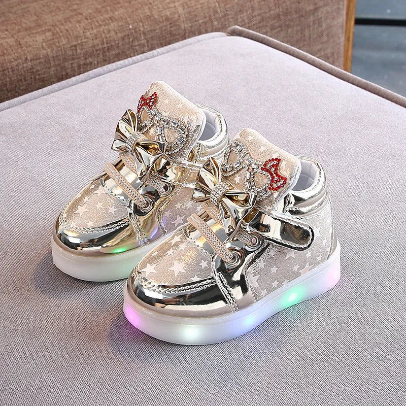 Golden, pink and silvery children's LED shoes with light-up soles, showing size chart from 21 to 30cm.