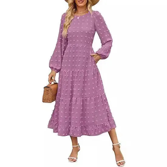 Women's beige long sleeve dress with ruffled sleeves and a high waist, shown on a hanger.