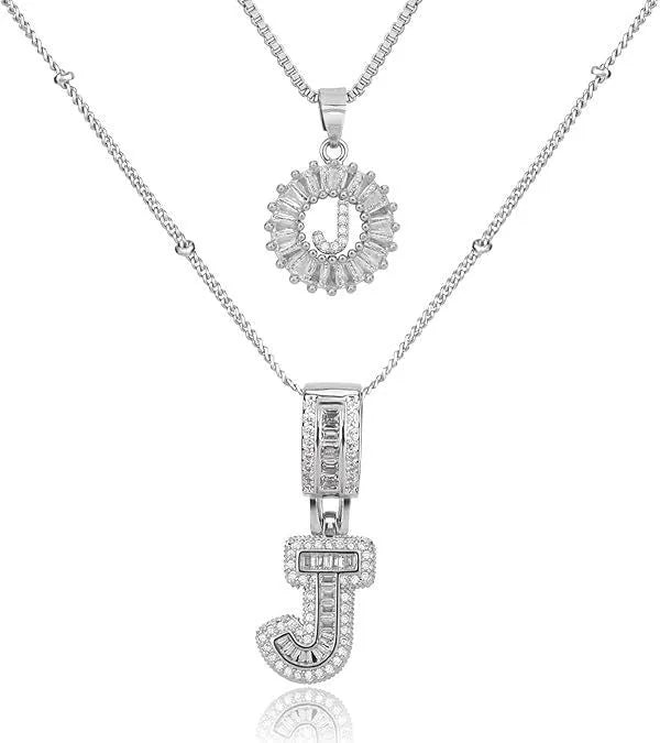 26 English letters copper-plated gold diamond initial pendant necklace with adjustable chain on display