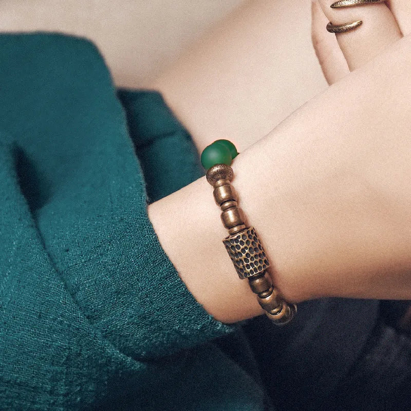 Retro ethnic style couples bracelet made of natural green and red agate beads on a string.