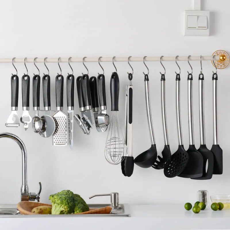 Black silicone kitchen utensil set with stainless steel handles including 16 pieces for cooking and baking