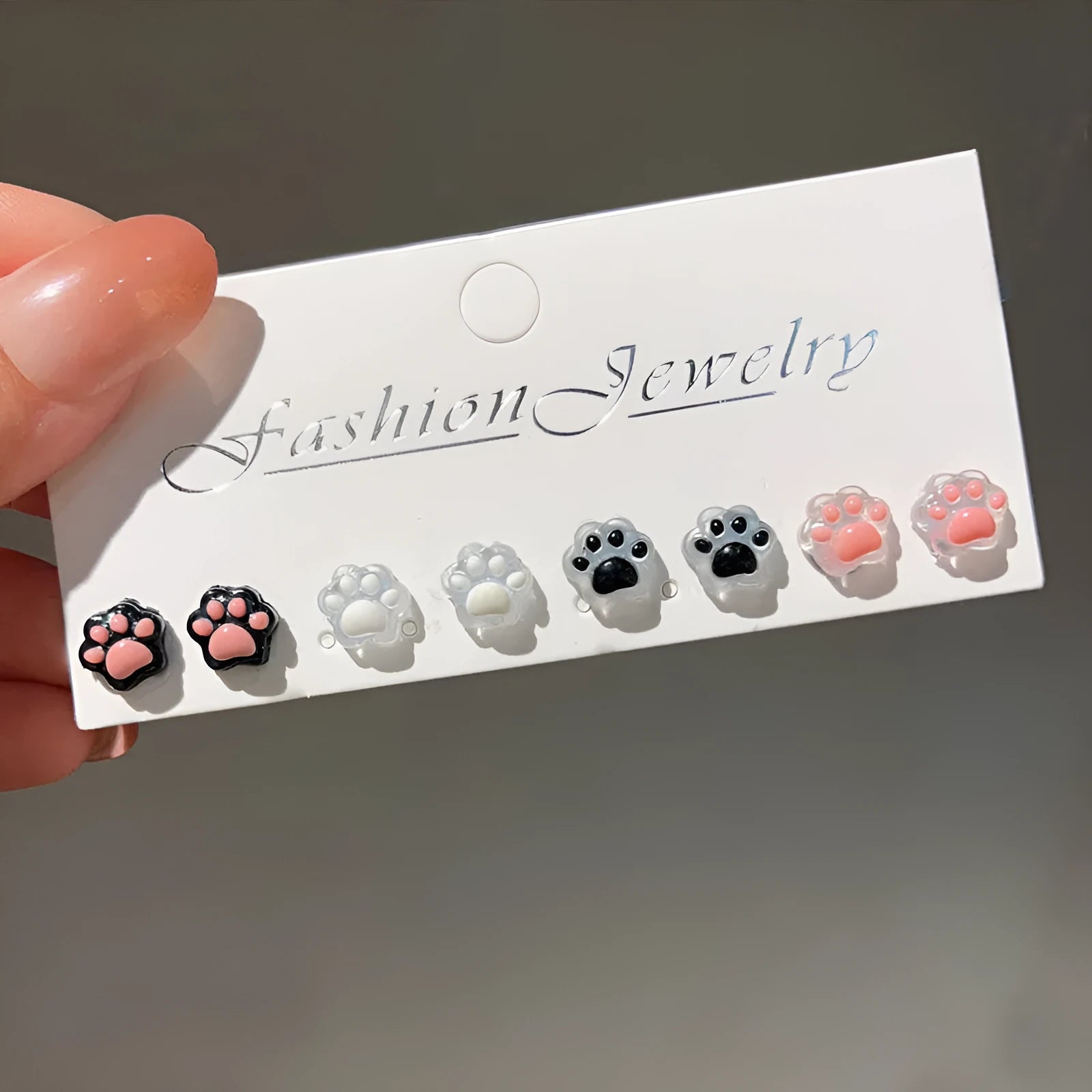 Cat paw magnetic ear clips in transparent pink colour, plastic resin material, animal zodiac style for women
