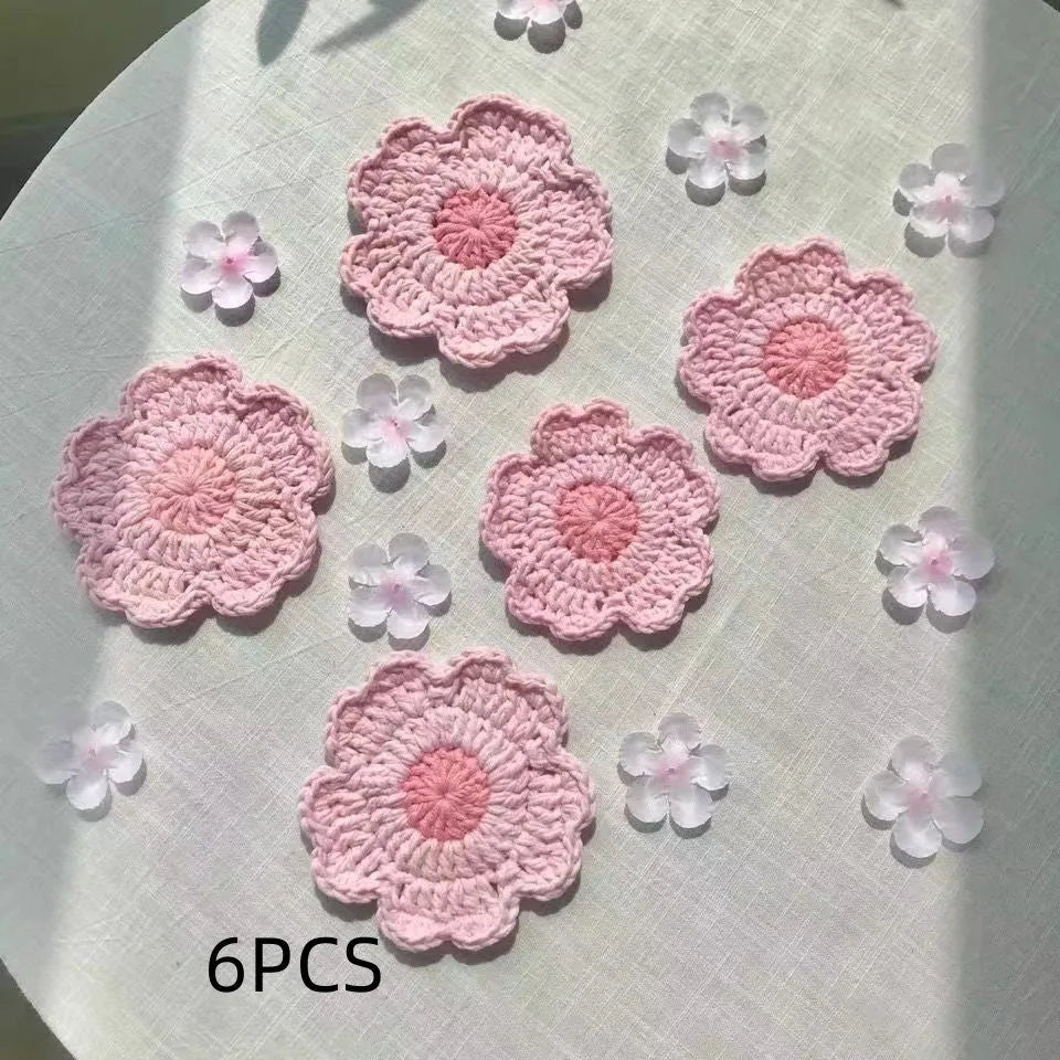 Hand-woven wool drink coaster on a wooden table