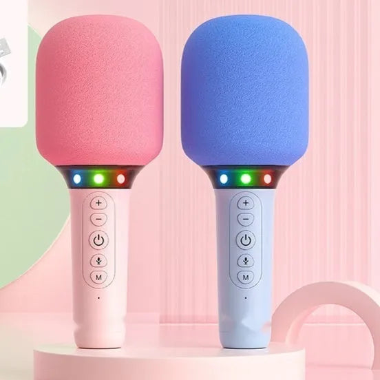 Bluetooth children's handheld karaoke microphone with built-in speaker in pink and white finish