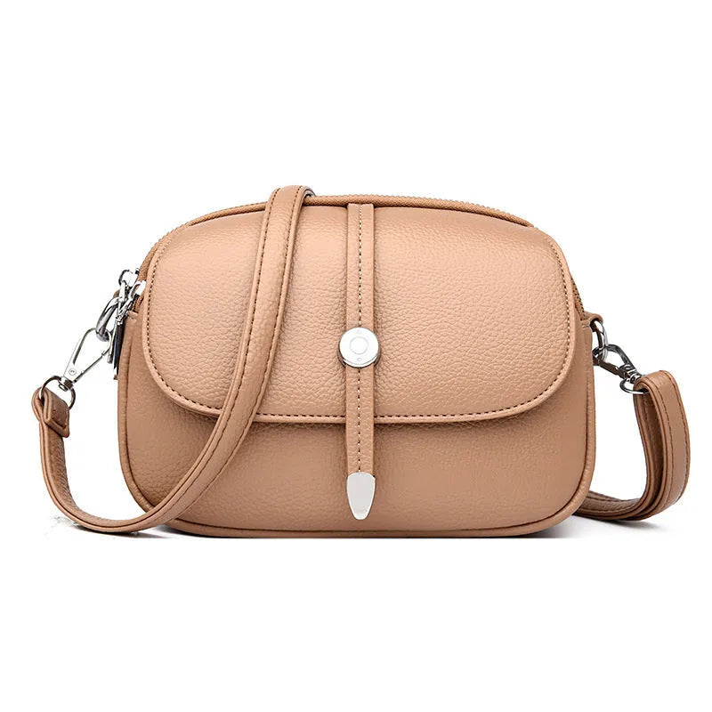 City Simple oval-shaped women's crossbody shoulder bag in khaki PU with sewing thread detail.