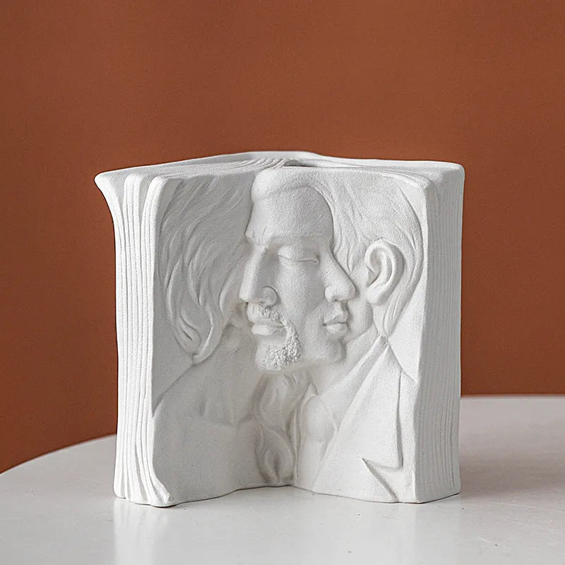 Glazed ceramic book stand ornament in one of four decorative styles on a wooden desk.