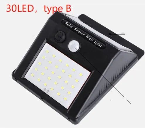 Solar outdoor garden lamp with LED lights and motion sensor in garden setting