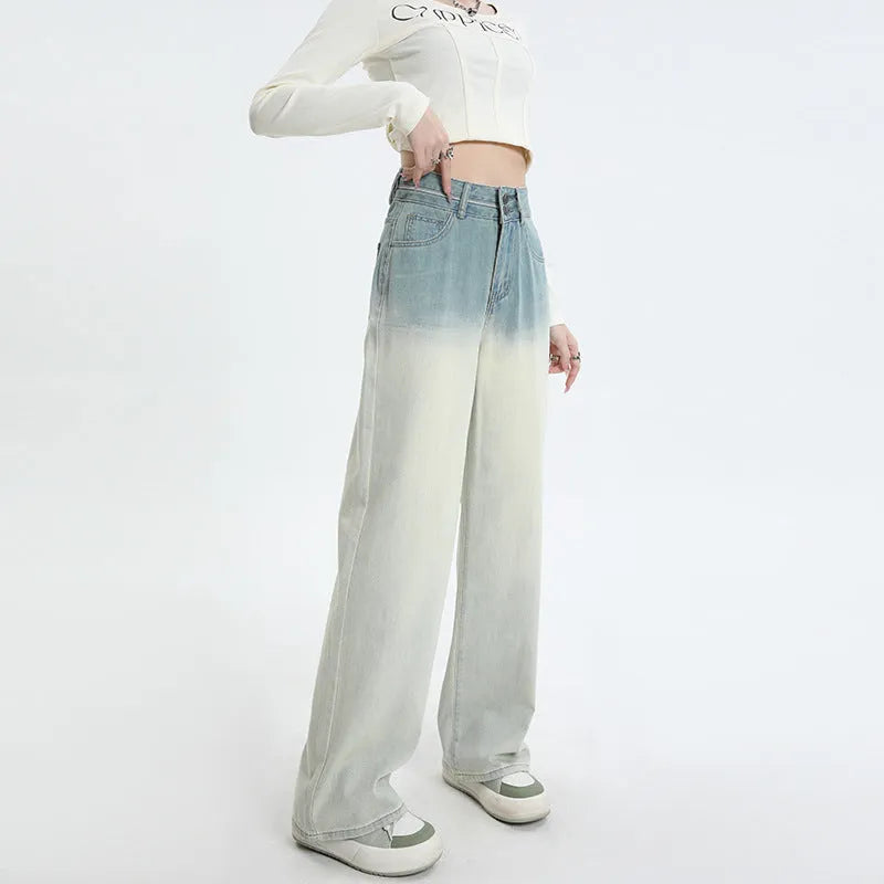 Women's gradient blue straight-leg denim trousers on a hanger.