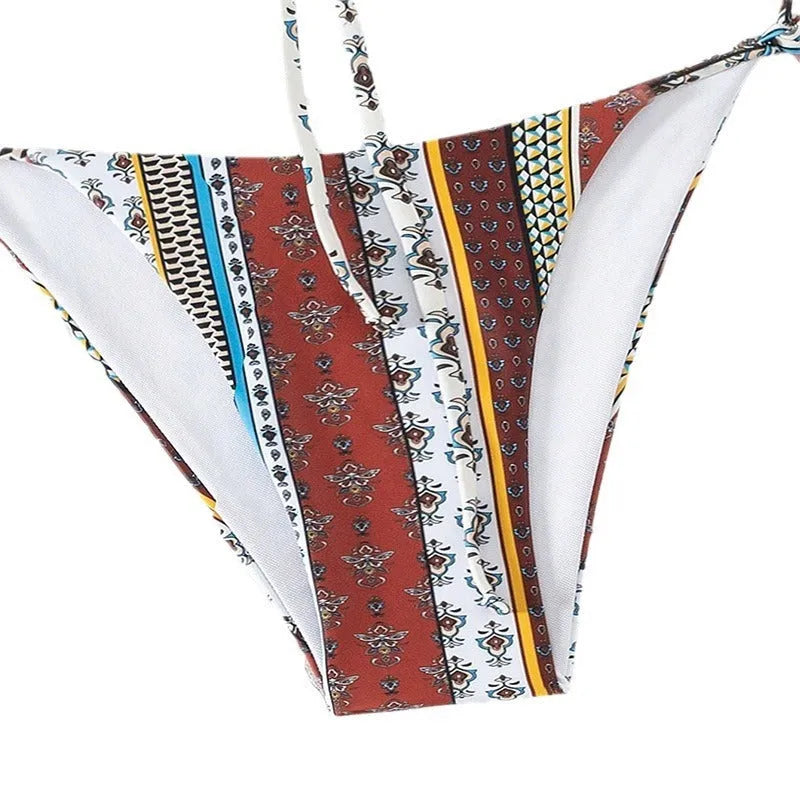 Women's mixed colour printed swimsuit with lace-up front and split leg design