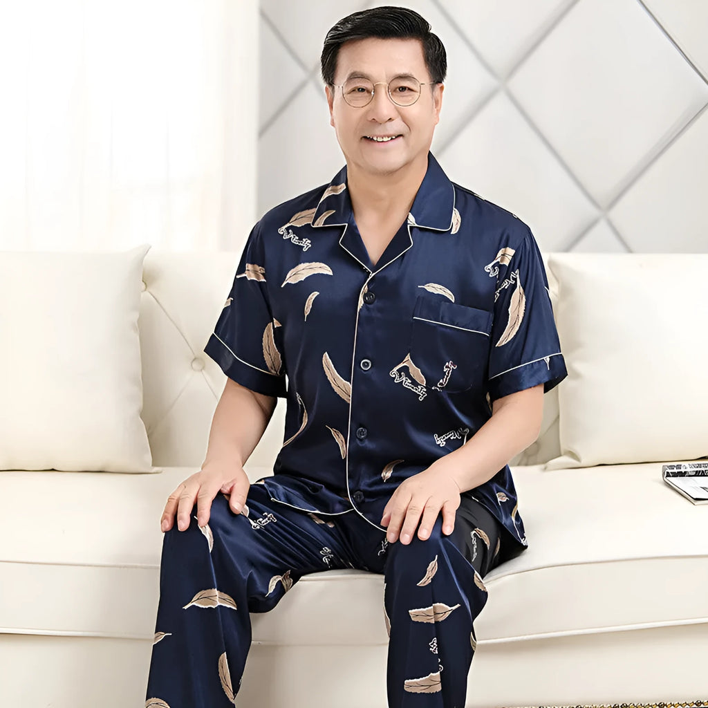 Men's ice silk pyjama set with front button top, small lapel collar, plant flower print, short sleeves and long trousers.