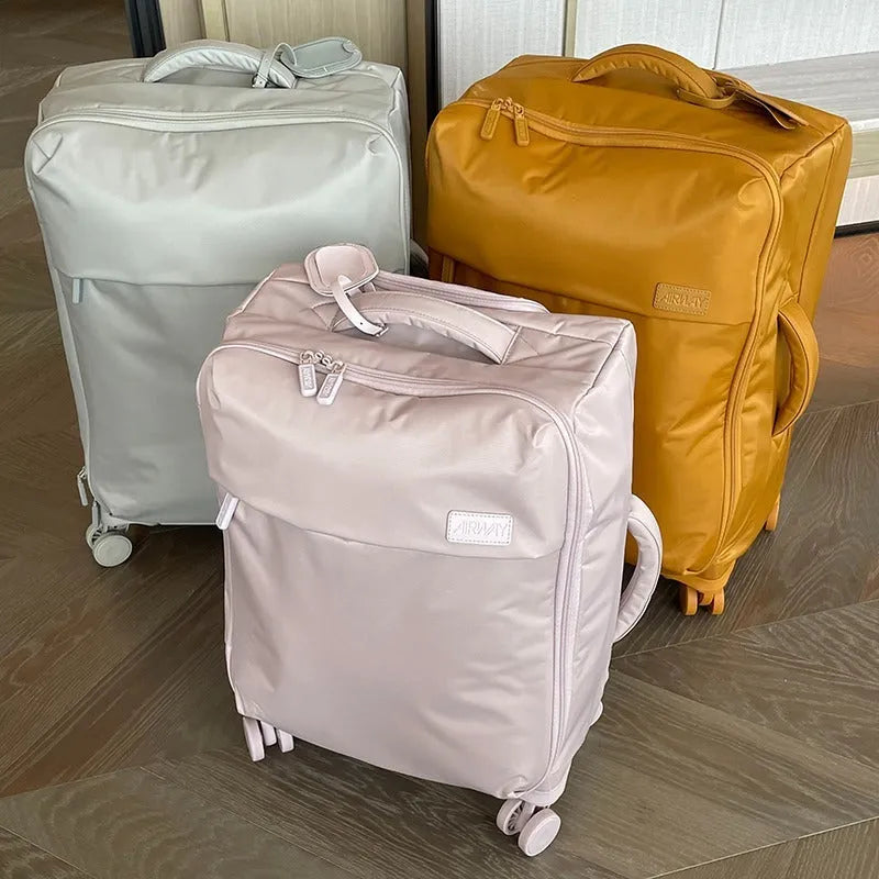 Ultra-light waterproof Oxford cloth suitcase in bluestone green with universal wheels, shown in 20-inch size