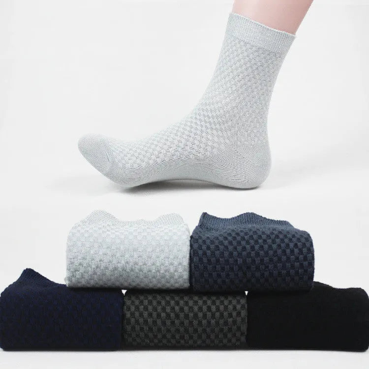 Pack of five men's bamboo fibre ankle socks in different colours, showing small square pattern.
