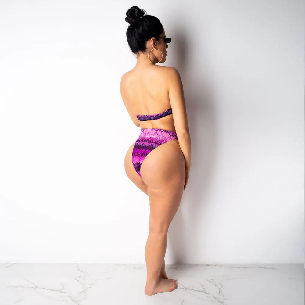 Women's purple snakeskin floral print long-sleeve swimsuit top and matching bikini bottoms.