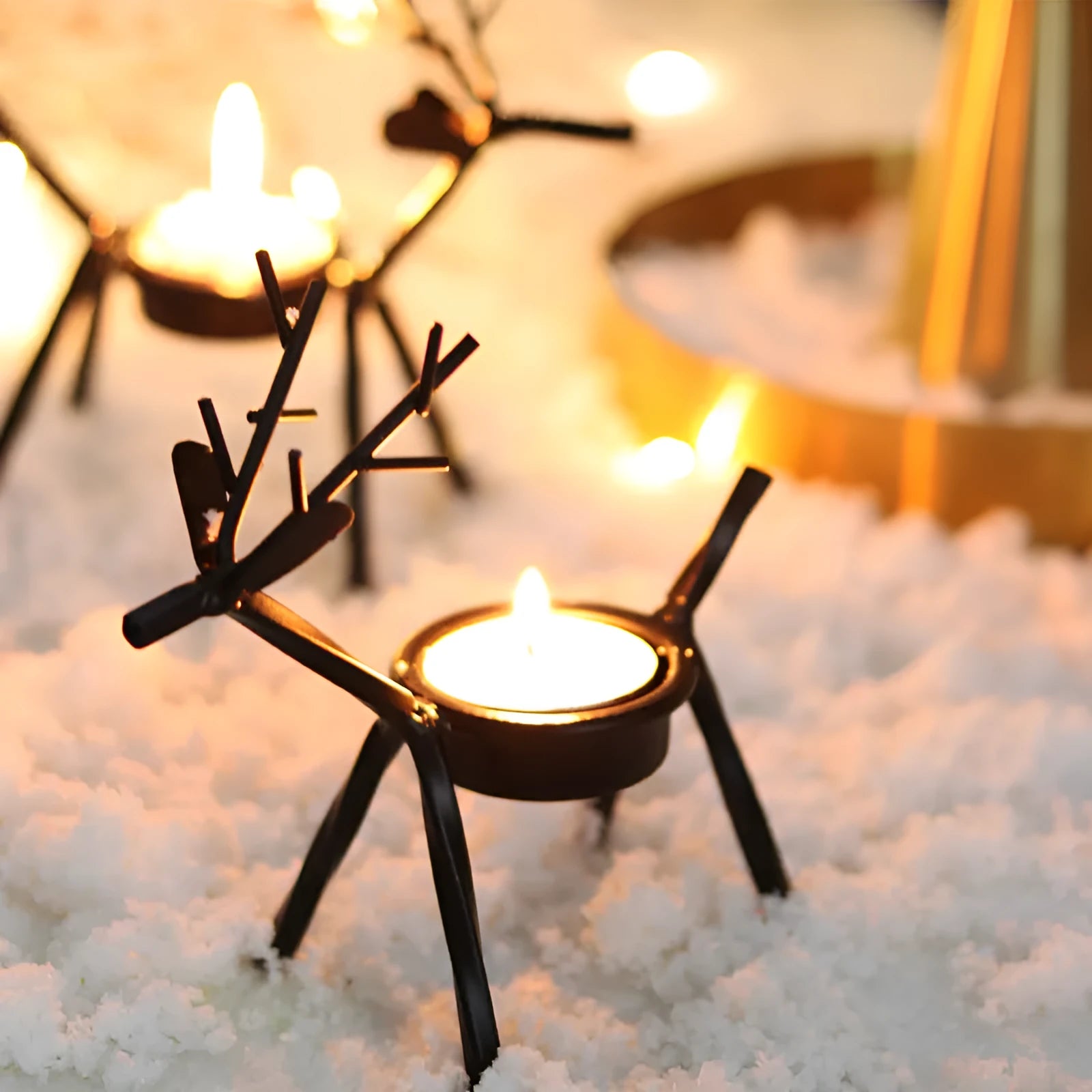 Black iron Christmas candlestick with decorative elk bracket and Santa Claus motifs