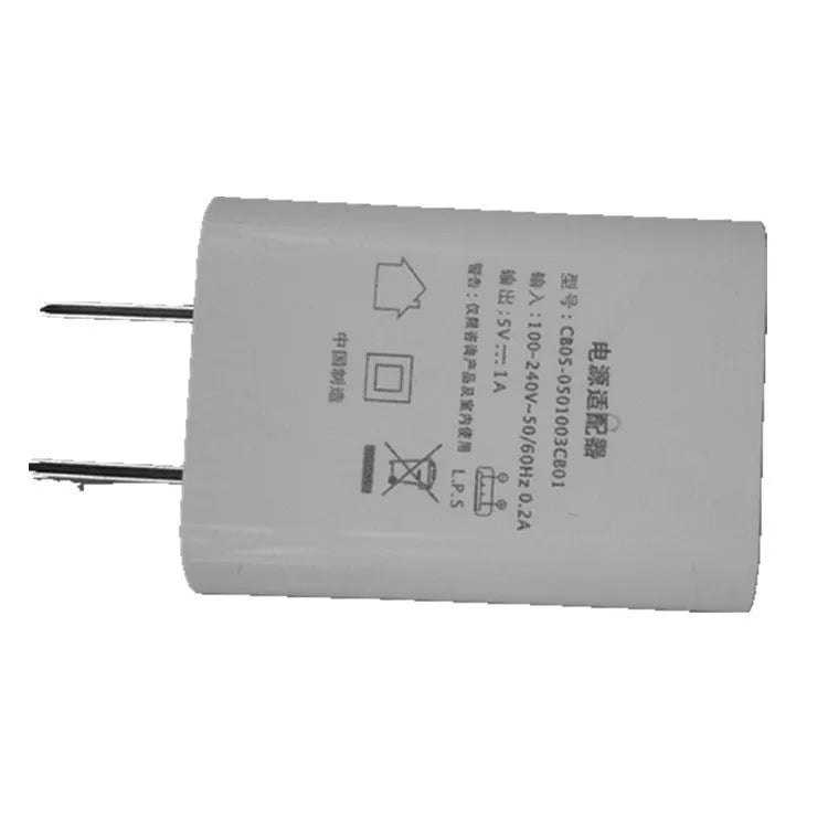 Thin white USB wall charger with CE and FCC marks on a plain background.