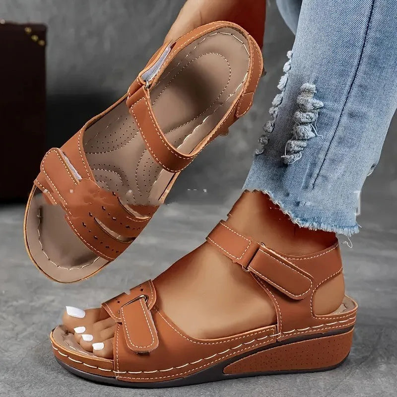 Beige plus size strap sandals with a thick composite sole and Velcro closure on a white background.