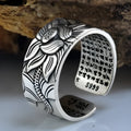 Thai silver black Lotus Heart Sutra ring with retro geometric pattern and matte oiling finish on grey background
