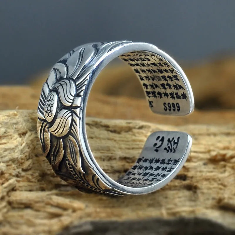 Thai silver black Lotus Heart Sutra ring with retro geometric pattern and matte oiling finish on grey background