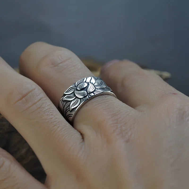 Thai silver black Lotus Heart Sutra ring with retro geometric pattern and matte oiling finish on grey background