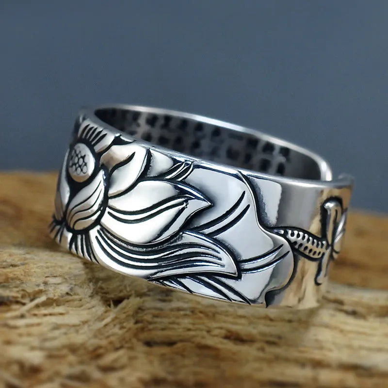 Thai silver black Lotus Heart Sutra ring with retro geometric pattern and matte oiling finish on grey background