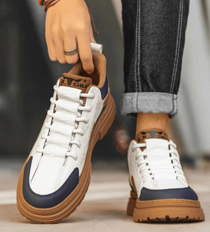 Black and white platform casual sneakers with chunky rubber soles on a white background