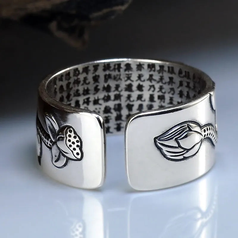 Thai silver black Lotus Heart Sutra ring with retro geometric pattern and matte oiling finish on grey background