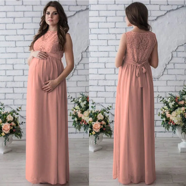 White lace sleeveless maternity dress with polyester fabric on dress form
