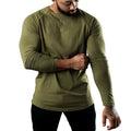 Men's tight-fitting long sleeve cotton sports T-shirt in grey, worn for gym training.