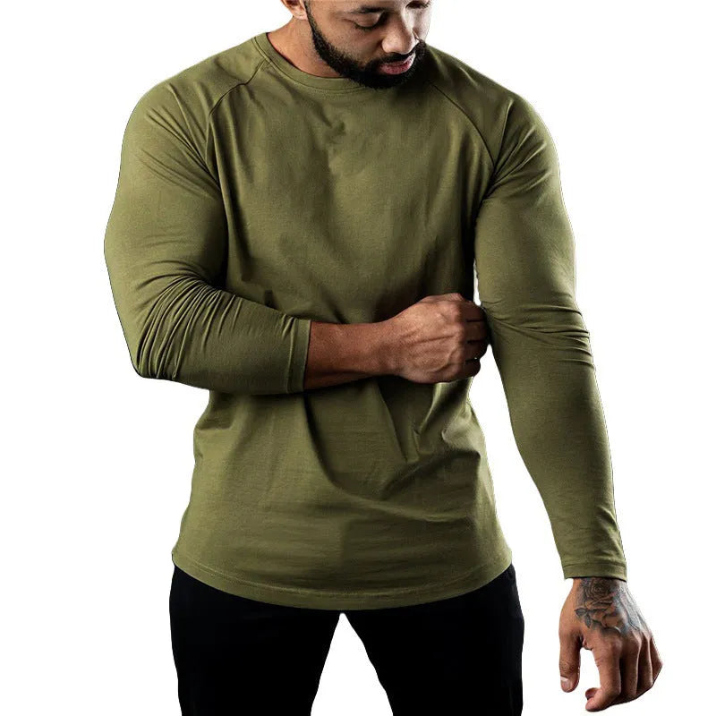 Men's tight-fitting long sleeve cotton sports T-shirt in grey, worn for gym training.