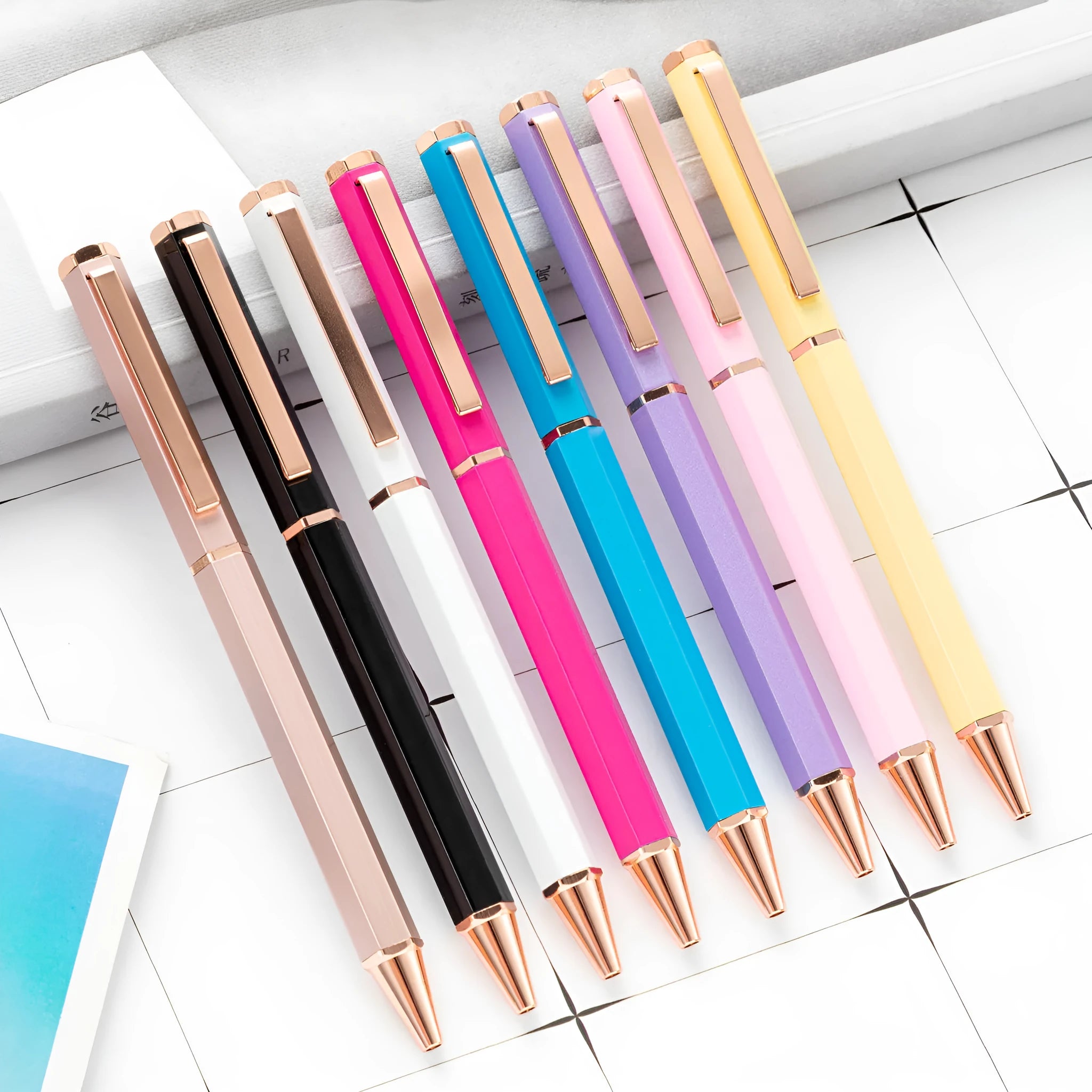Metal six-angle ballpoint pen in black with 1.0mm bullet tip on white surface