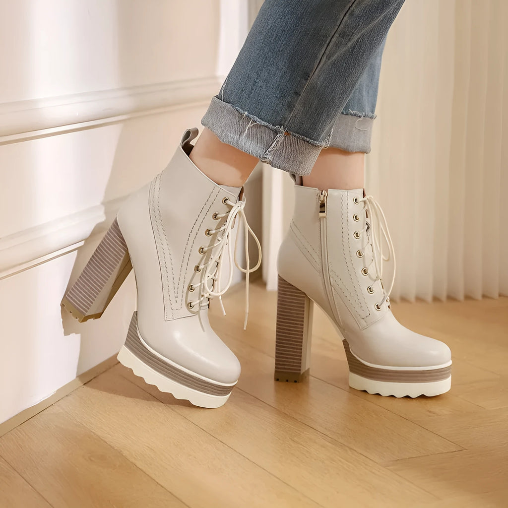 Women's black waterproof cowhide leather ankle boots with a chunky heel and side zip