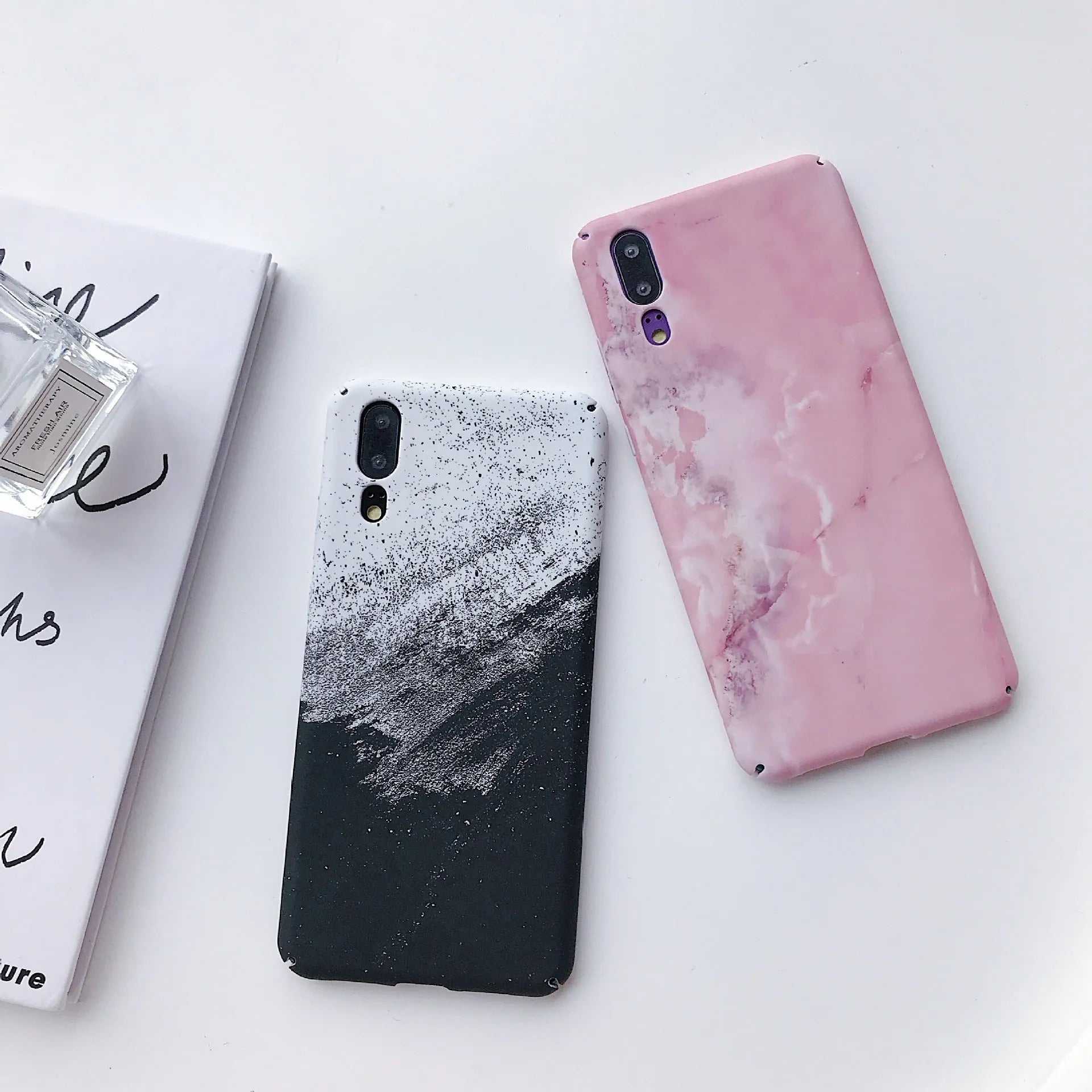 Solid colour painted phone case for Huawei and Honor smartphones in black and pink options.
