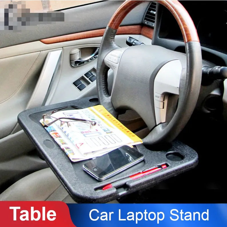 Multifunctional car desk in black ABS, 425 x 285 x 25mm, mounted on car steering wheel with adjustable angle.