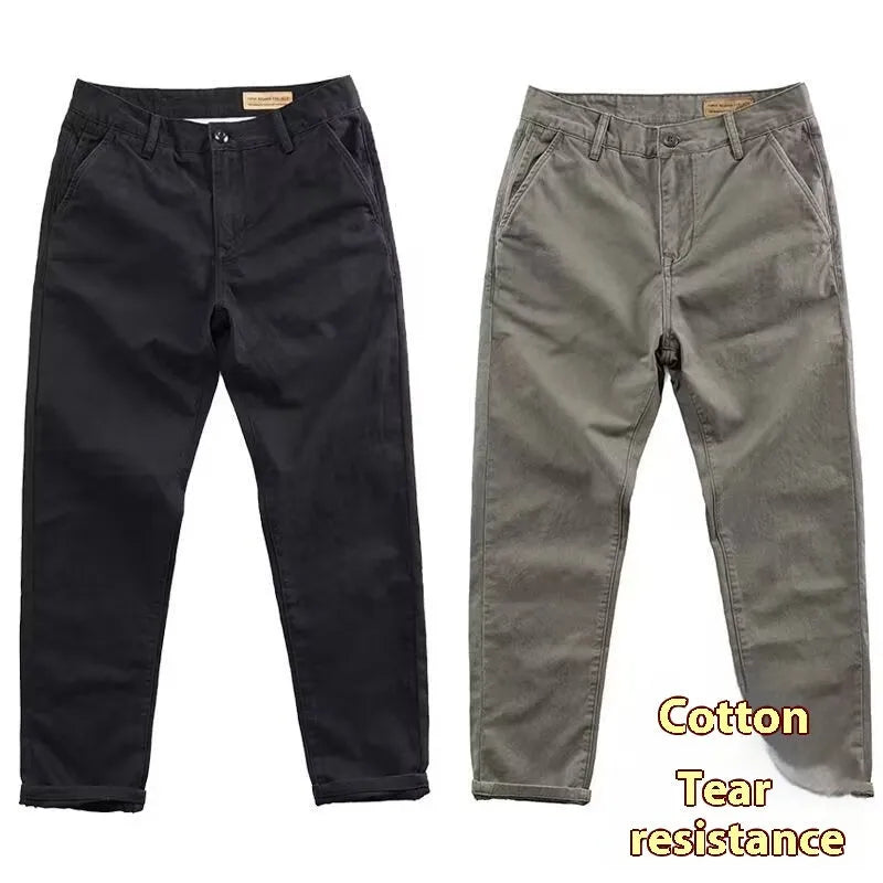 Man wearing slim-fit washed casual trousers in a neutral colour, showcasing the straight-leg style.