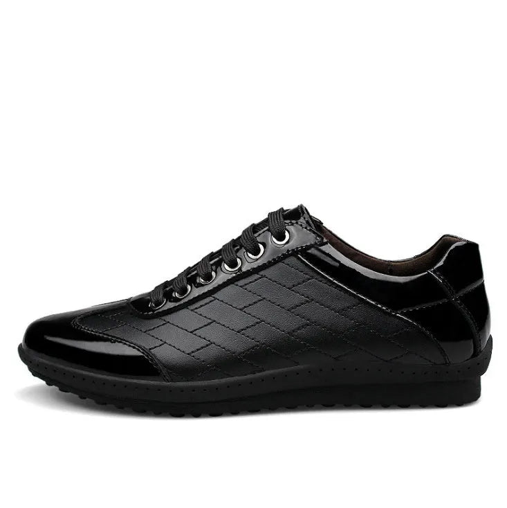 Genuine leather casual men's shoes in black with lace-up closure on a plain background