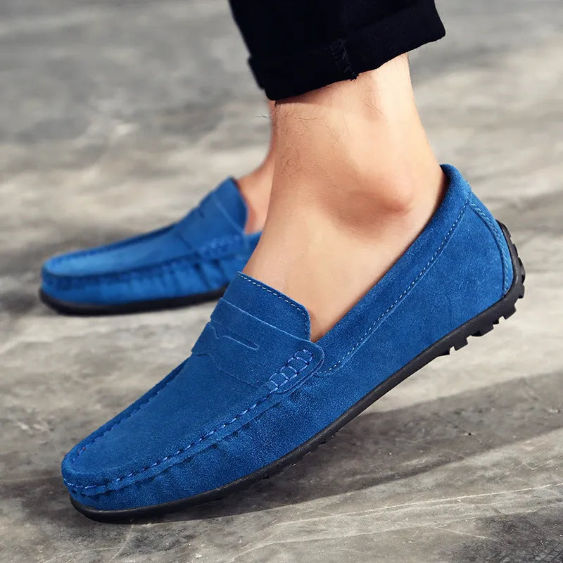Men's brown suede Gommino-style low-top casual shoes with a round toe and flat rubber sole.