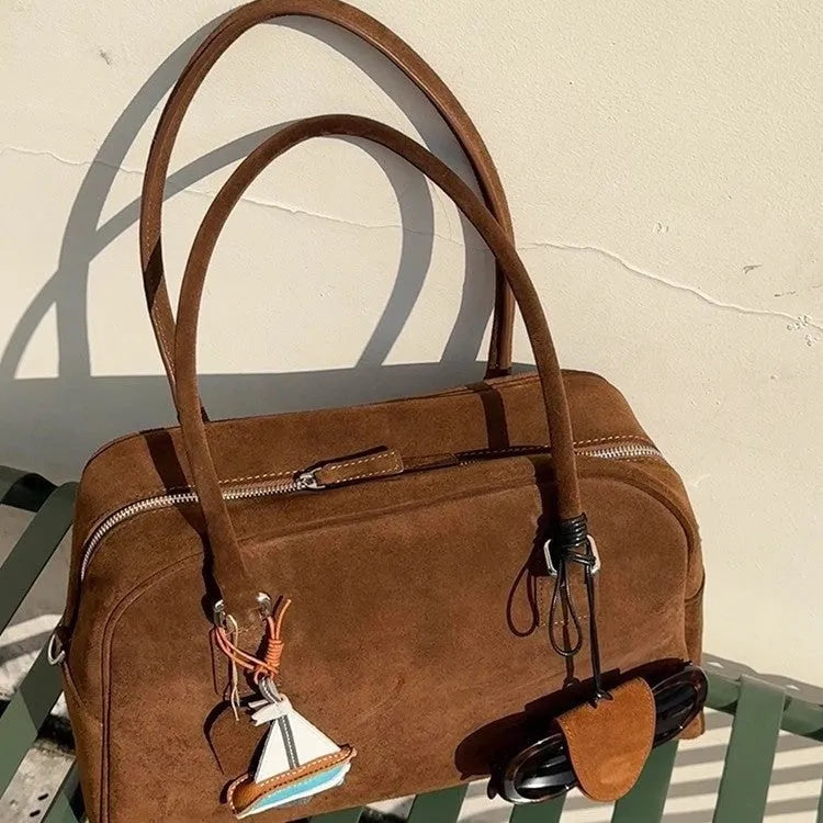 Brown suede large capacity underarm pillow bag with horizontal square shape and zipper closure