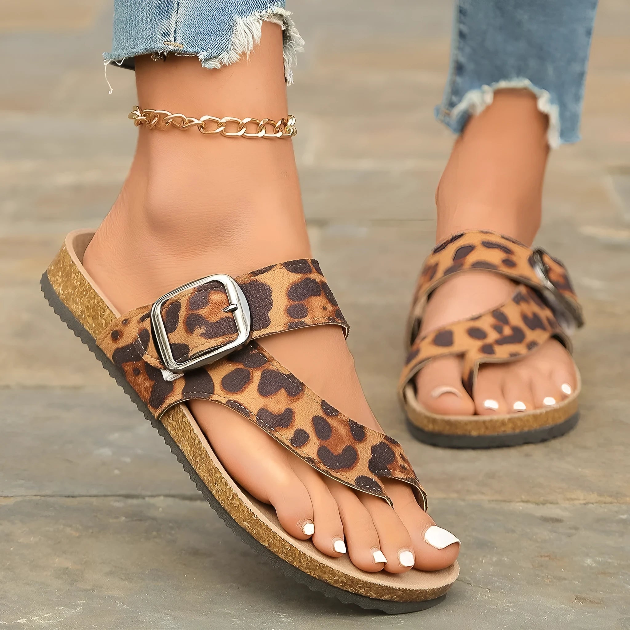 Leopard print Roman style slippers with rounded toe covering and wooden sole.
