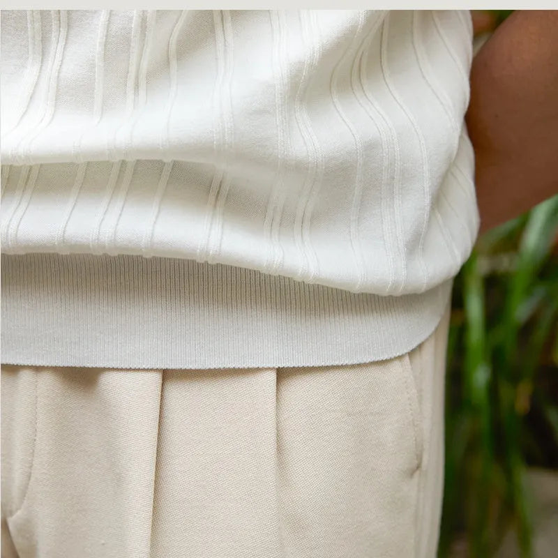 Short sleeve slim fit sunken stripe knitwear top in 100% lyocell, available in black and white, sizes M to 3XL