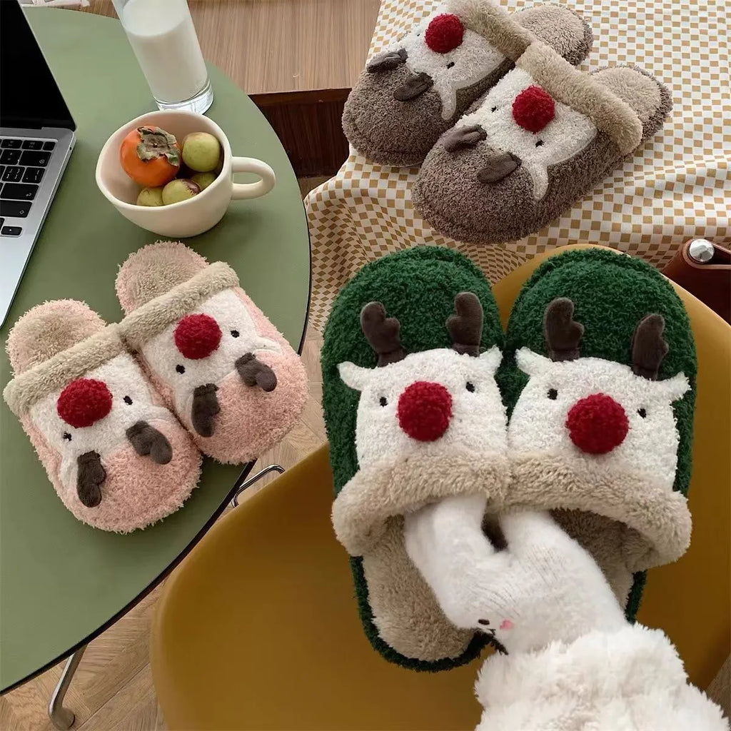 Women's green Christmas deer plush slippers with non-slip PVC soles.