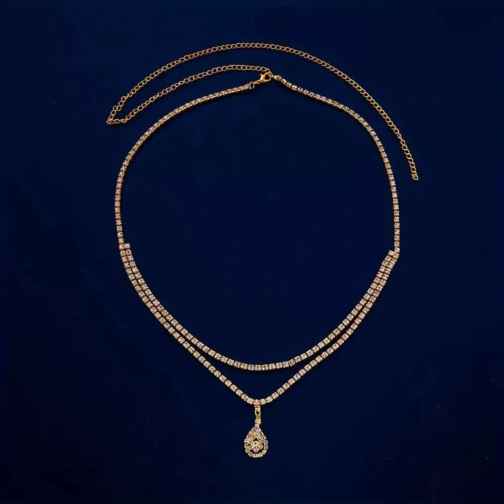 Gold or silver women's waist chain with rhinestone drop pendant and tassel, 105cm long.