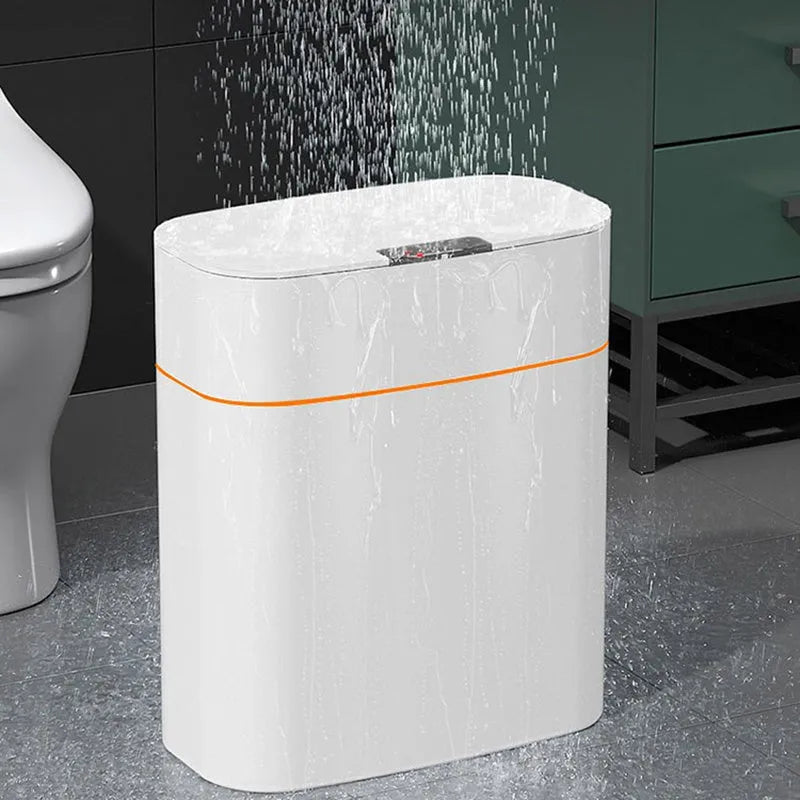 White smart induction trash can with automatic opening lid, shown in a kitchen setting.